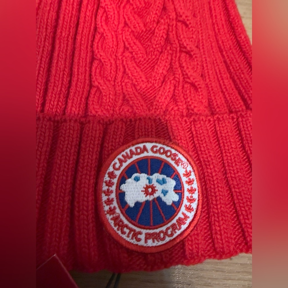 Canada Goose Arctic Disc Toque knit beanie in red. NWT